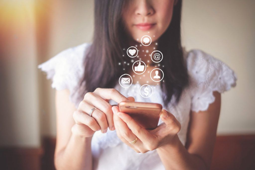 girl using social networks on the phone