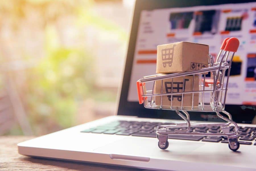 Trolly on laptop for shopping online